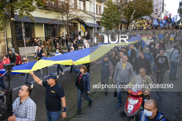 Veterans, activists and supporters of Ukraine's nationalist movements take part in a procession to mark the Defender of Ukraine Day and the...