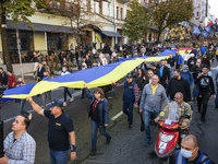 Veterans, activists and supporters of Ukraine's nationalist movements take part in a procession to mark the Defender of Ukraine Day and the...