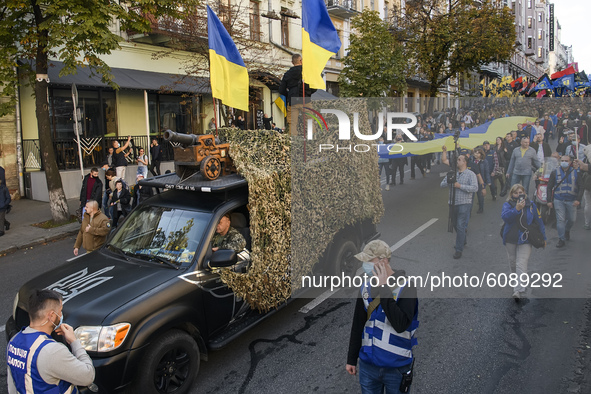 Veterans, activists and supporters of Ukraine's nationalist movements take part in a procession to mark the Defender of Ukraine Day and the...