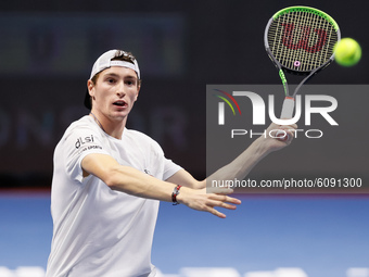 Ugo Humbert of France returns the ball to Andrey Rublev of Russia during their ATP St. Petersburg Open 2020 international tennis tournament...