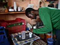 Anton Gordon is preparing English coffee in the small shop his family owns in the village of Kostur, Bulgaria on May 02, 2015 (