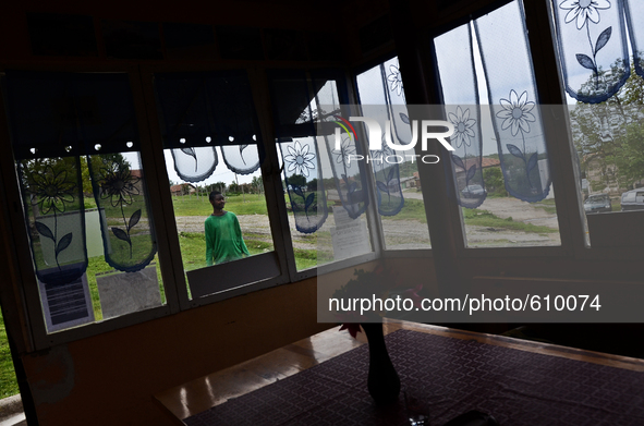 Anton Gordon is having a walk outside the small shop owned by his family in the village of Kostur, Bulgaria  on May 02, 2015 