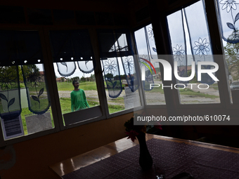 Anton Gordon is having a walk outside the small shop owned by his family in the village of Kostur, Bulgaria  on May 02, 2015 (