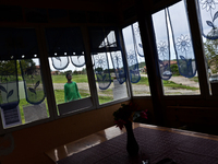 Anton Gordon is having a walk outside the small shop owned by his family in the village of Kostur, Bulgaria  on May 02, 2015 (