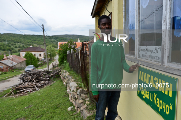 Anton Gordon is showng the newly made plate of the shop in the village of Kostur, Bulgaria on May 02, 2015 