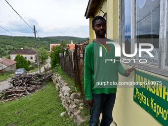 Anton Gordon is showng the newly made plate of the shop in the village of Kostur, Bulgaria on May 02, 2015 (