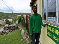 Anton Gordon is showng the newly made plate of the shop in the village of Kostur, Bulgaria on May 02, 2015 (