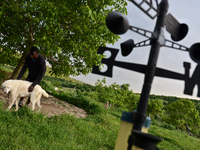 Rhys is having fun with his dog in the village of Kostur, Bulgaria on May 12, 2015 (