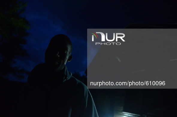 Narrall Gordon standing in front of his house in the night in the village of Kostur, Bulgaria on May 12, 2015 