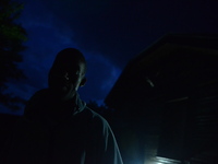 Narrall Gordon standing in front of his house in the night in the village of Kostur, Bulgaria on May 12, 2015 (