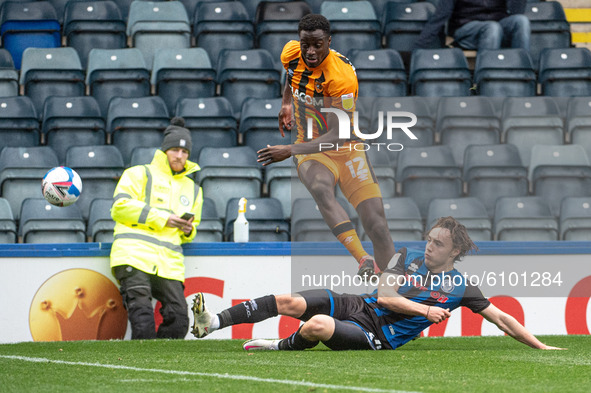 Ollie Rathbone of Rochdale AFC tackles Josh Emmanuel of Hull City FC during the Sky Bet League 1 match between Rochdale and Hull City at Spo...