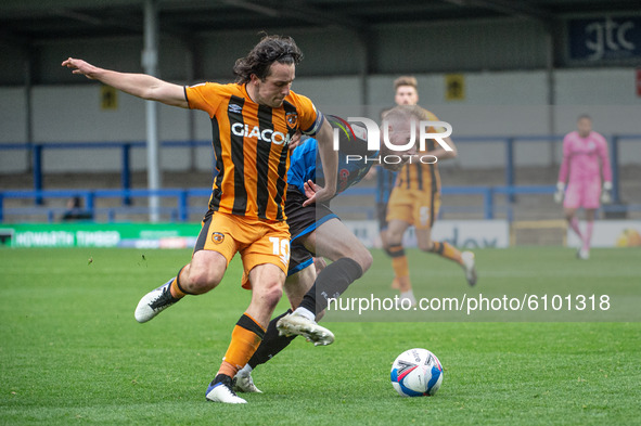 George Honeyman of Hull City FC id tackled by Stephen Dooley of Rochdale AFC during the Sky Bet League 1 match between Rochdale and Hull Cit...