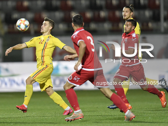 Darius Olaru of Romania U21 in action against Omar Elouni of Malta U21 during the soccer match between Romania U21 and Malta U21 of the Qual...