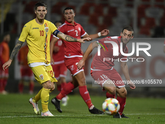 Dennis Man of Romania U21 in action against Gary Camilleri of Malta U21 during the soccer match between Romania U21 and Malta U21 of the Qua...