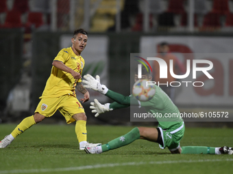 Alexandru Matan of Romania U21 in action against Cain Formosa of Malta U21 during the soccer match between Romania U21 and Malta U21 of the...