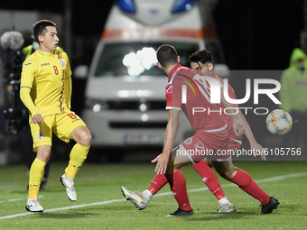 Olimpiu Morutan of Romania U21 in action against Christian Gauci of Malta U21 during the soccer match between Romania U21 and Malta U21 of t...