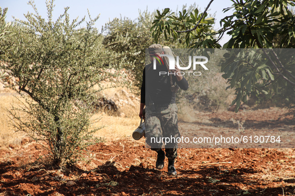 Members of the Syrian armed opposition (Jaysh al-Izza) target sites of the Syrian regime in the southern countryside of Idlib in the northwe...