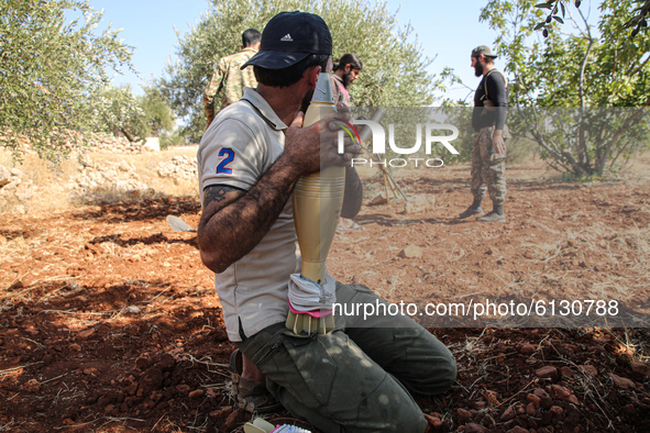 Members of the Syrian armed opposition (Jaysh al-Izza) target sites of the Syrian regime in the southern countryside of Idlib in the northwe...