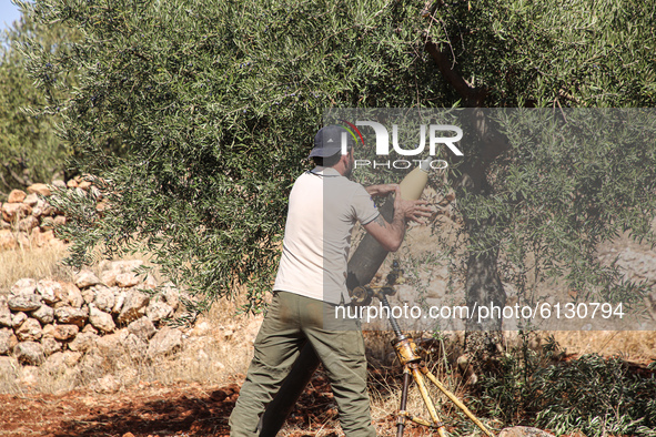 Members of the Syrian armed opposition (Jaysh al-Izza) target sites of the Syrian regime in the southern countryside of Idlib in the northwe...