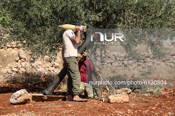 Members of the Syrian armed opposition (Jaysh al-Izza) target sites of the Syrian regime in the southern countryside of Idlib in the northwe...