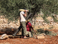 Members of the Syrian armed opposition (Jaysh al-Izza) target sites of the Syrian regime in the southern countryside of Idlib in the northwe...