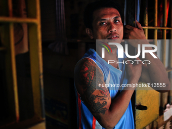 Go to http://nurphoto.com/reportages/ to see more - DRAGON / Roland who has been staying in jail for 11 years because of murder chose the Dr...