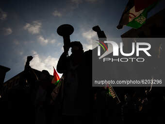A man speaks through a megaphone during a demonstration to demand the end of Morocco's occupation in Western Sahara, in support of the Polis...