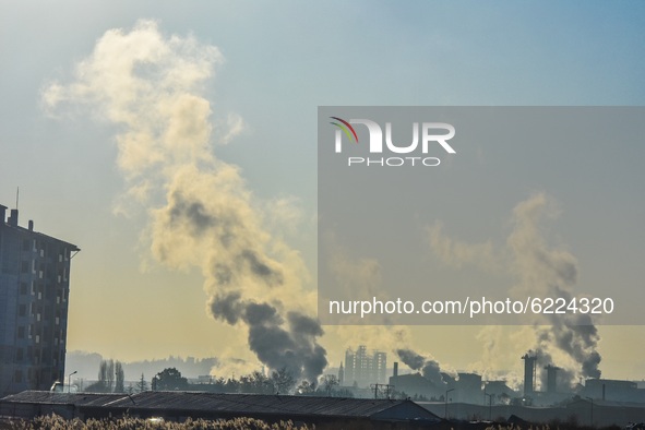Smoke rises from the chimneys of a factory in Etimesgut district on November 28, 2020 in Ankara, Turkey. 