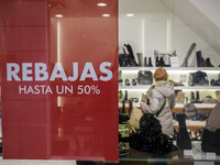 Sale posters are seen in stores at the beginning of the winter sales season in Palma de Mallorca while the autonomic Mallorca government wil...