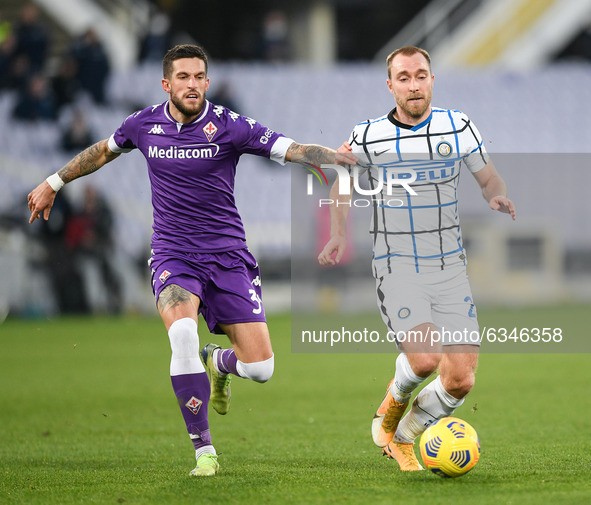 Christian Eriksen of FC Internazionale and Cristiano Biraghi of ACF Fiorentina compete for the ball during the Coppa Italia match between AC...