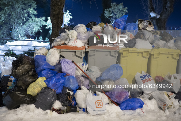 Accumulated garbage is seen in the streets of Madrid due to the snow caused by storm Filomena on January 14, 2021 in Madrid, Spain. 