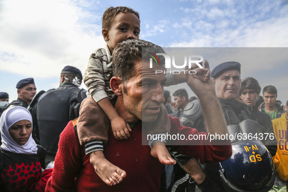 Migrants are waiting to enter to the transfer camp in Opatovac near border crossing point between Serbia and Croatia. Opatovac, Croatia. Sep...