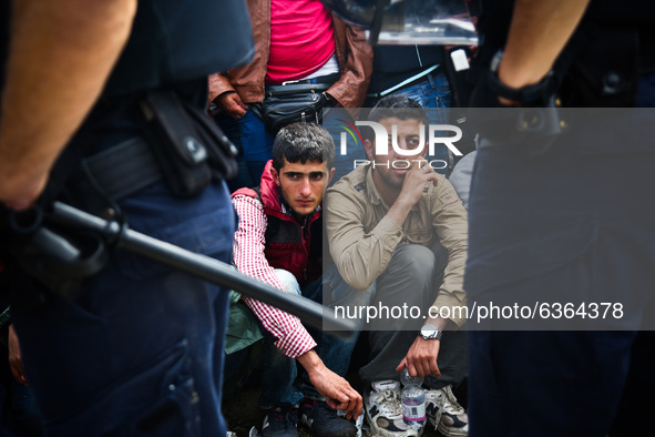 Migrants are waiting to enter to the transfer camp in Opatovac near border crossing point between Serbia and Croatia. Opatovac, Croatia. Sep...