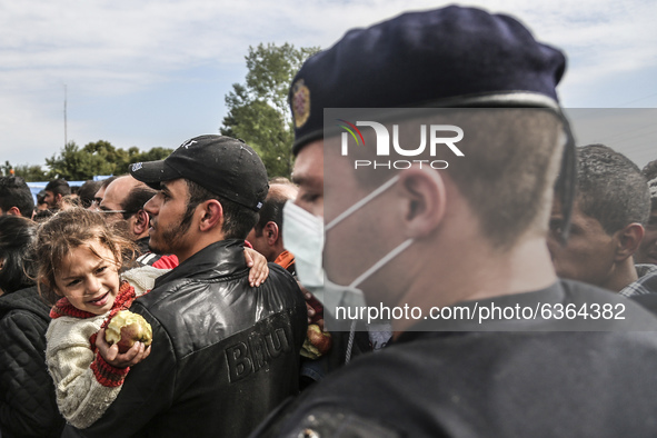 Migrants are waiting to enter to the transfer camp in Opatovac near border crossing point between Serbia and Croatia. Opatovac, Croatia. Sep...