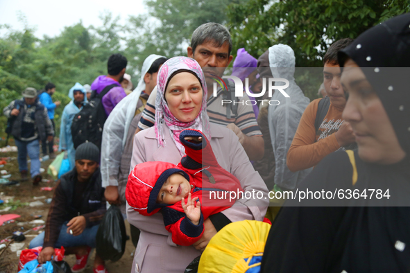 Refugees arrive at the Serbia-Croatia border, between Berkasovo and Bapska on September 26, 2015. A record number of refugees from the Middl...