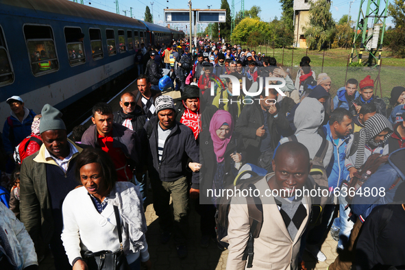 Migrants arrive by train to Hegyeshalom train station near the Hungarian-Austrian border. Hegyeshalom, Hungary. 28 September 2015. A record...