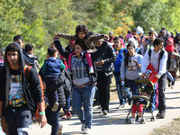 Hundreds of refugees walk to the Hungarian-Austrian border between Hegyeshalom and Nickelsdorf, after they arrived by train to Hegyeshalom,...