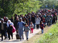 Hundreds of refugees walk to the Hungarian-Austrian border between Hegyeshalom and Nickelsdorf, after they arrived by train to Hegyeshalom,...