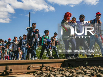 Hundreds of refugees walk to the Hungarian-Austrian border between Hegyeshalom and Nickelsdorf, after they arrived by train to Hegyeshalom,...