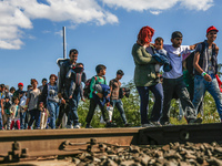 Hundreds of refugees walk to the Hungarian-Austrian border between Hegyeshalom and Nickelsdorf, after they arrived by train to Hegyeshalom,...