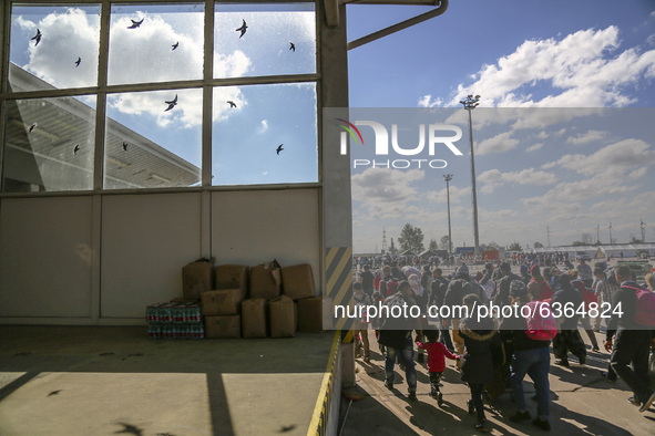 Refugees walk to the Hungarian-Austrian border between Hegyeshalom and Nickelsdorf, after they arrived by train to Hegyeshalom, Hungary on 2...