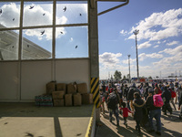 Refugees walk to the Hungarian-Austrian border between Hegyeshalom and Nickelsdorf, after they arrived by train to Hegyeshalom, Hungary on 2...