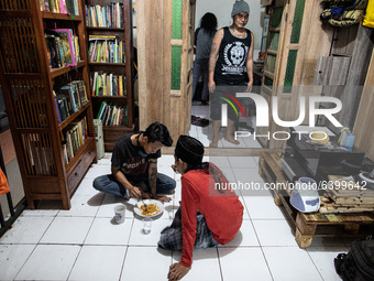 Students having lunch after praying. Islamic boarding school for punk and street children in Ruko Cimanggis, Ciputat, South Tangerang, Bante...