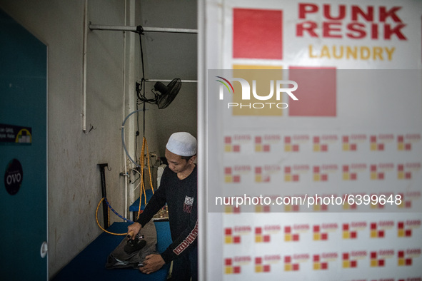 Laundrya business by boarding school that called " Punk Resik Laundry (Clean Punk Laundry). Islamic boarding school for punk and street chil...