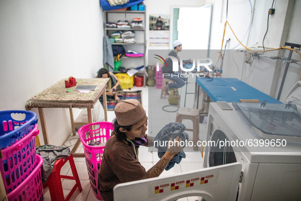 Laundry business run by the boarding school. Islamic boarding school for punk and street children in Ruko Cimanggis, Ciputat, South Tangeran...