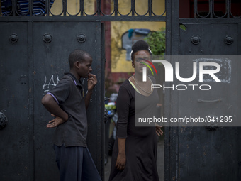 Migrants rest outside "Baobab" migration centre next to the Tiburtina train station in Rome on June 15, 2015. Hundreds of migrants mainly fr...