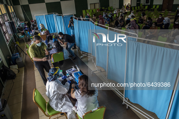  Vaccination process. 2nd Phase of Vaccination covid19 for health worker in Indonesia held at one of location at Health Dipoloma Education S...