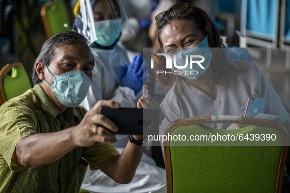  Health Workeres take selfie after vaccination.  2nd Phase of Vaccination covid19 for health worker in Indonesia held at one of location at...