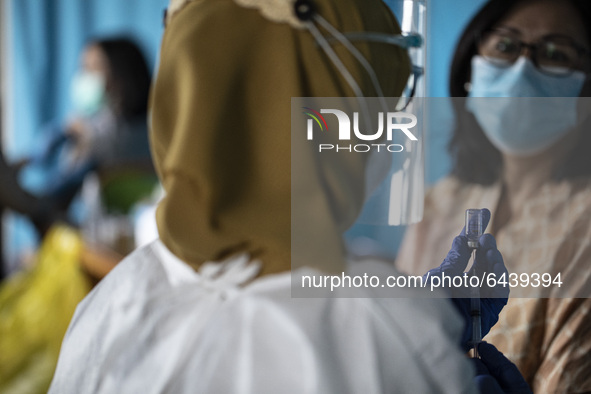  Medic team prepare the vaccination. 2nd Phase of Vaccination covid19 for health worker in Indonesia held at one of location at Health Dipol...