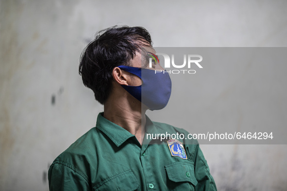 Jakarta, Indonesia, 23 February 2021 :RIDO the sumateran tiger care taker at the zoo posed for a picture.  During pandemic covid19 Zoo Anima...